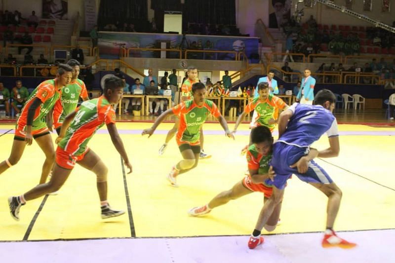 Bangladesh&#039;s defender dashing the raider out of the court against Afghanistan.