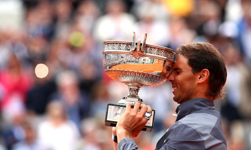 Rafael Nadal hoists aloft his record-extending 12th Roland Garros title