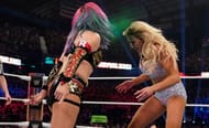 Asuka sprays the green mist on Charlotte