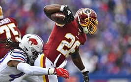 The Latest: Peterson running strong with 101 yards at half