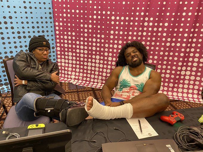 Xavier Woods and Ember Moon showing off their battle scars