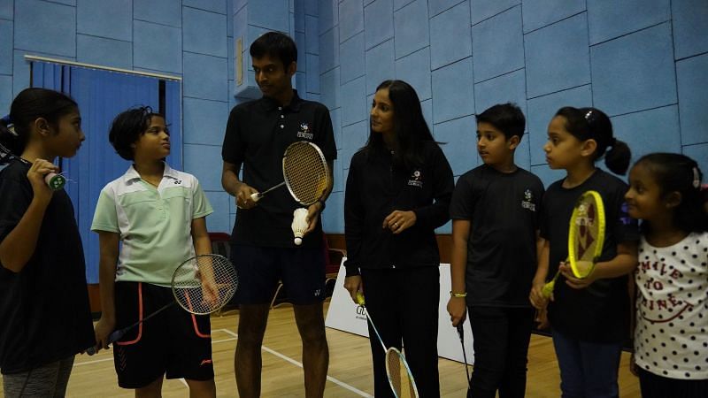 Pullela Gopichand interacts with kids at a badminton clinic, even as Aparna Popat looks on, during the official launch of the Badminton Gurukul at MCA Club in BKC on Thursday.