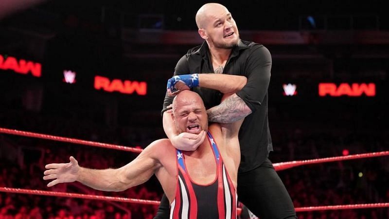 Baron Corbin puts the squeeze on the Olympic Gold Medalist Kurt Angle.