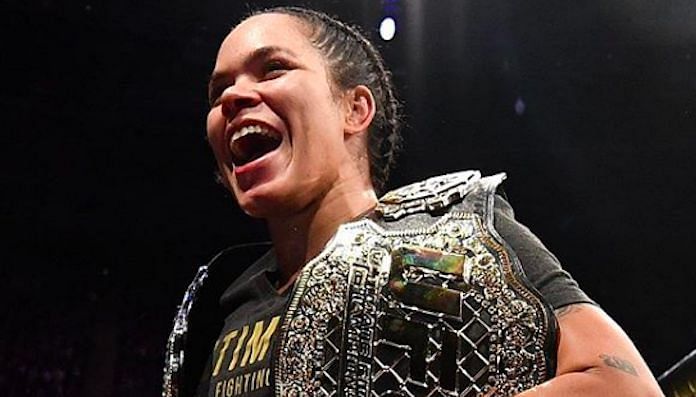 Amanda Nunes with her two Championship belts