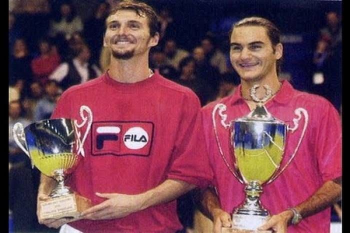 Federer (right) won his first singles title at 2001 Milan