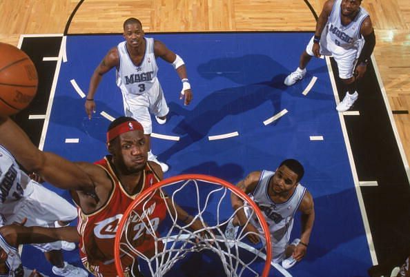 LeBron James finishes a dunk in traffic against the Orlando Magic