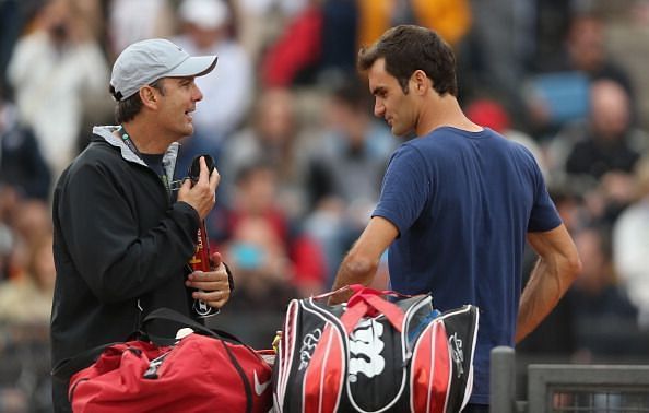 Paul Annacone (L) and Roger Federer