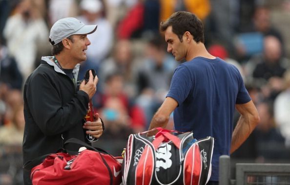 Paul Annacone (L) and Roger Federer