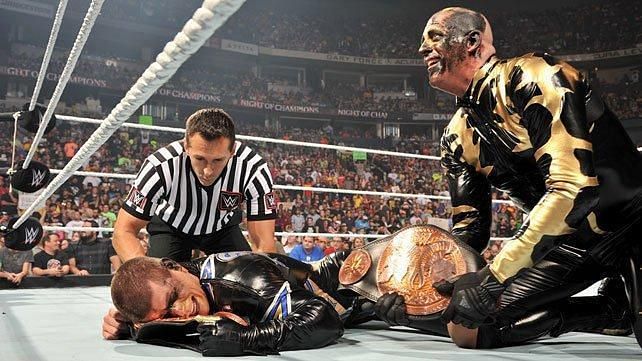 Goldust and Stardust celebrate after winning tag team gold