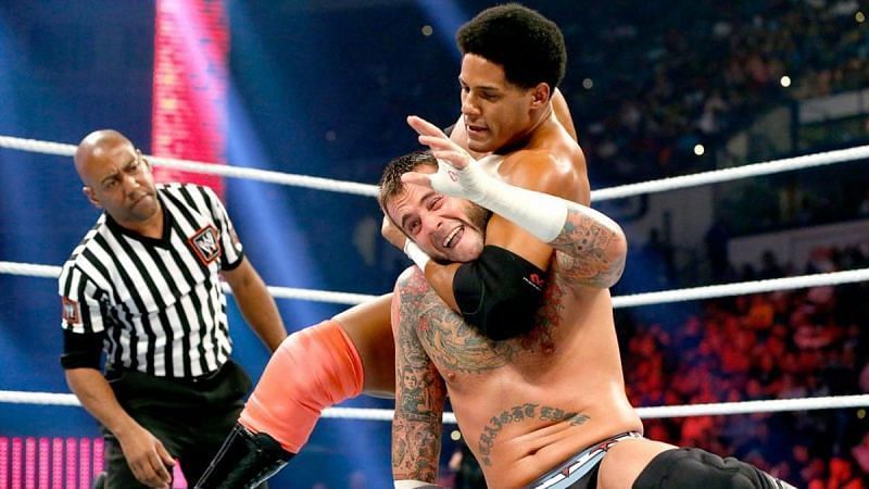 Darren Young taking on CM Punk in the ring