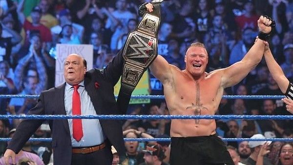 Brock Lesnar celebrates his WWE title win, after defeating Kofi Kingston in a matter of seconds