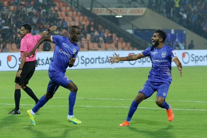 Modou Sougou celebrates with Subhasish Bose after scoring a goal