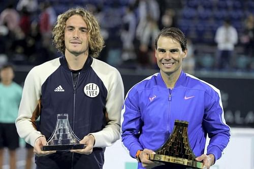 Stefanos Tsitsipas (left) and Rafael Nadal with their trophies at the Mubadala World Tennis Championship