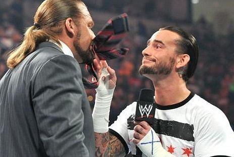 CM Punk (right) confronting Triple H