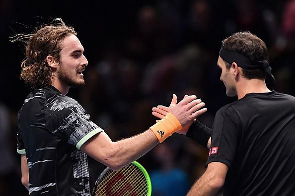 Stefanos Tsitsipas (L) and Roger Federer