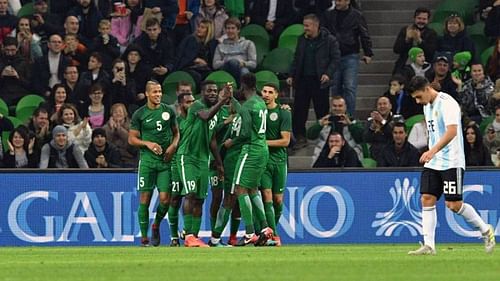 Nigerian players celebrate a goal against Argentina