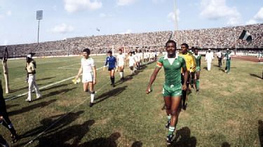 Christian Chuwku (right) leading Nigeria out in the final of the 1980 Nations Cup