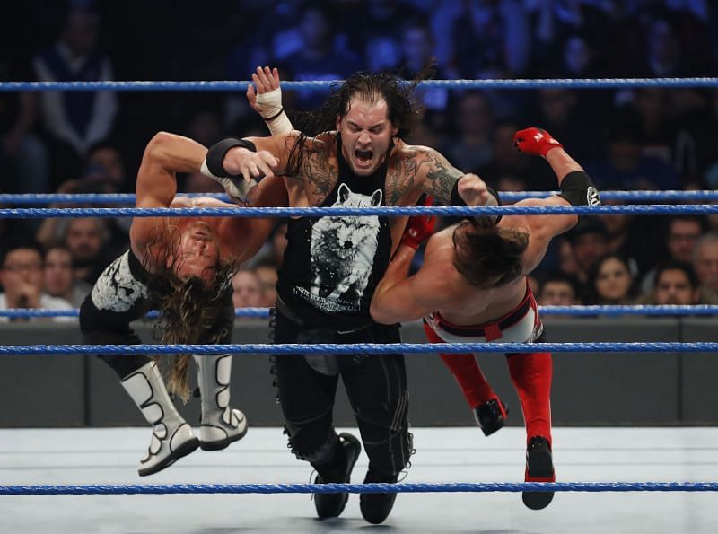 Baron Corbin takes down two opponents at the same time with twin clotheslines.
