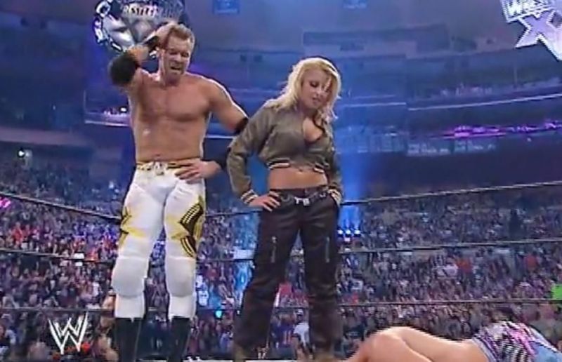 Christian and Trish celebrate over a fallen Jericho