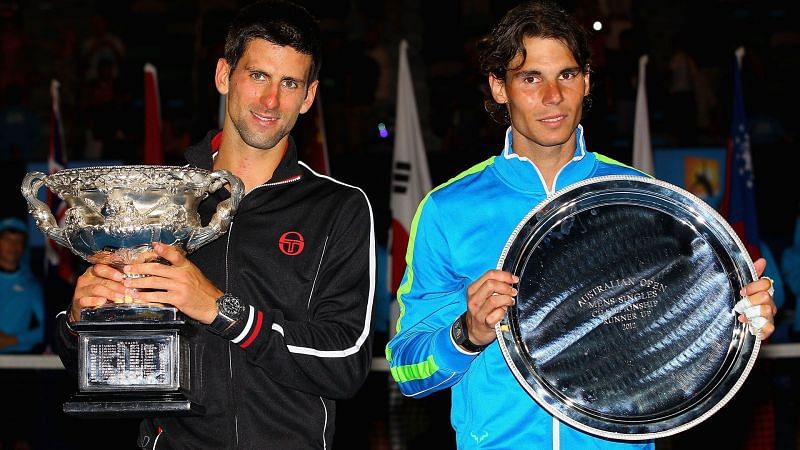 Djokovic (right) poses with Nadal following the 2012 Australian Open final