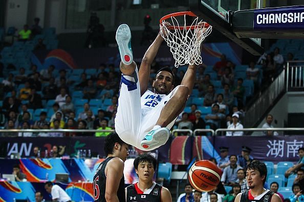 Amjyot Singh finishes a dunk during India&#039;s match against Japan in the 2015 FIBA Asia Championship