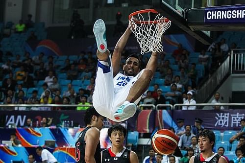 Amjyot Singh finishes a dunk during India's match against Japan in the 2015 FIBA Asia Championship