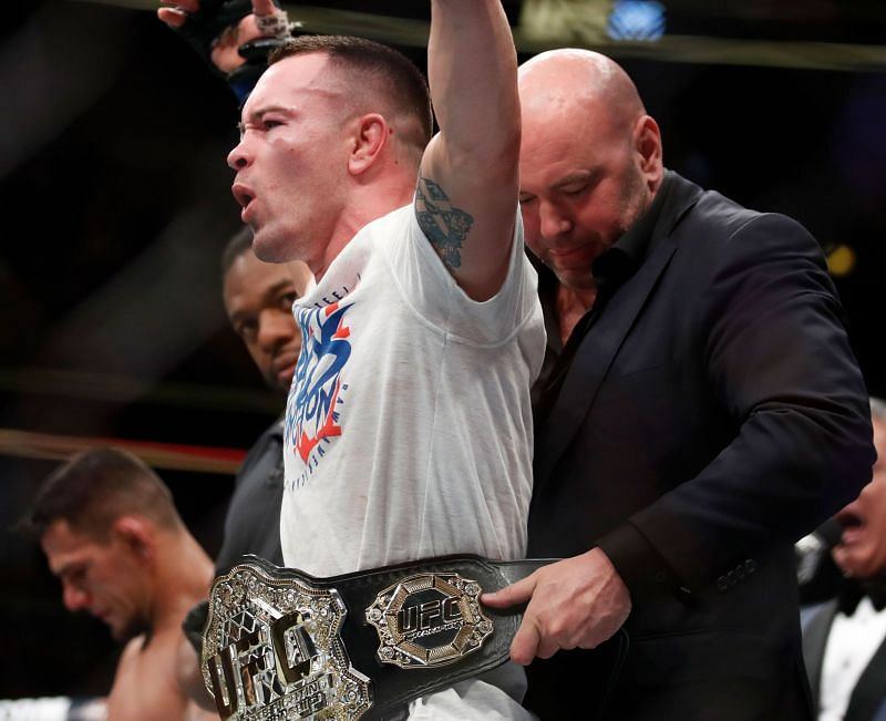 Dana White wrapping the interim UFC Welterweight Title around Colby Covington&#039;s waist