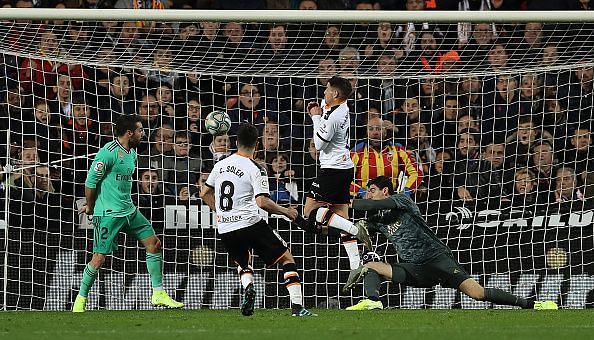 Carlos Soler blasts the ball beyond the reach of Thibaut Courtois