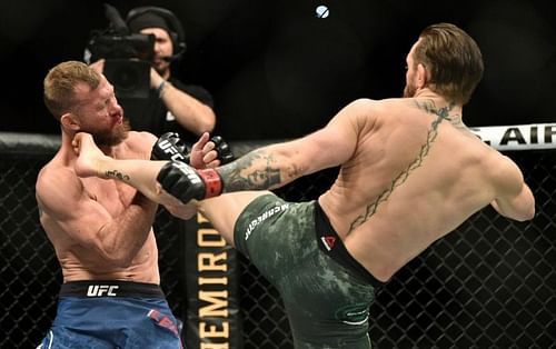 Conor McGregor lands a head kick on Donald Cerrone