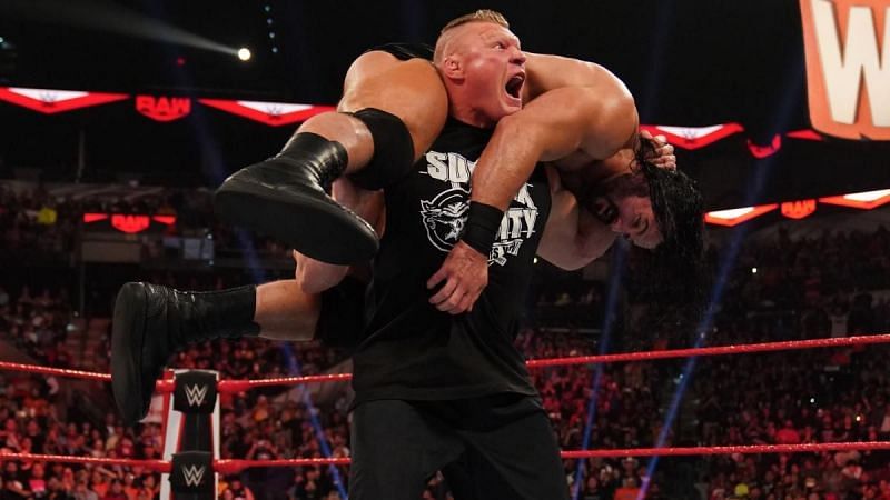 Brock Lesnar lifting Drew McIntyre up
