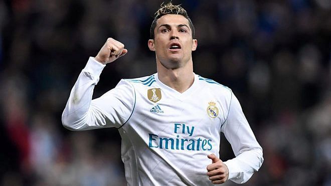Cristiano Ronaldo exults after scoring his 100th Champions League goal for Madrid