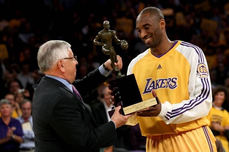 Kobe Bryant collects the award from the then NBA Commissioner David Stern