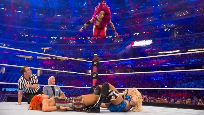 Sasha Banks performs a high-risk maneuver
