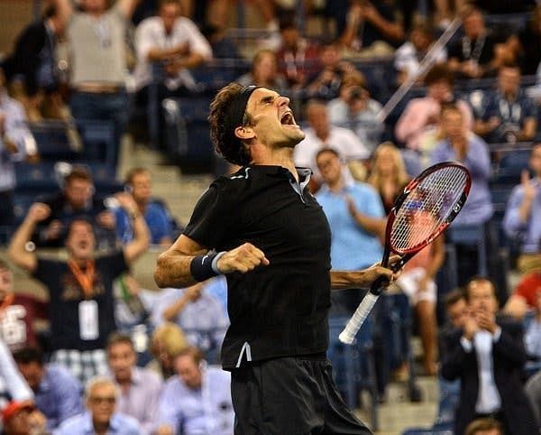 Federer exults after beating Monfils in the quarterfinals of the 2014 US Open