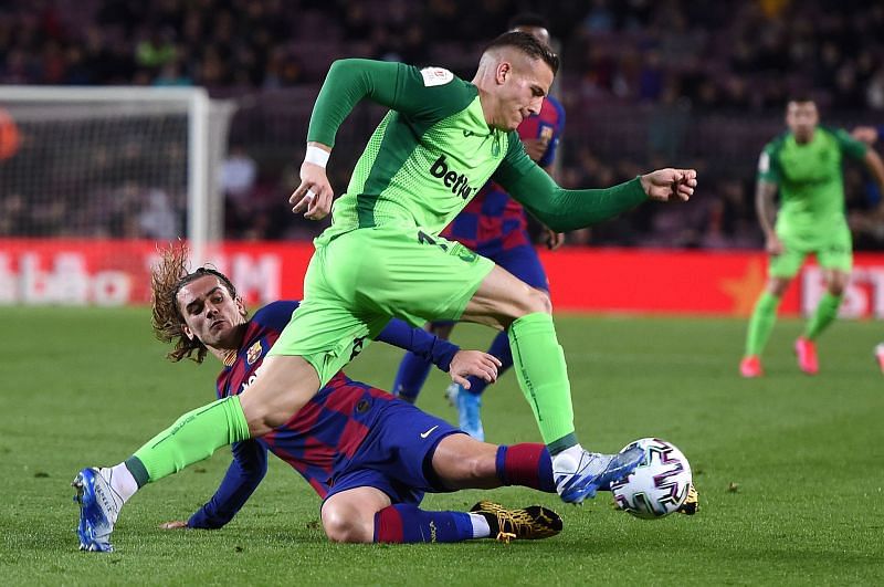 Tarin attempts to skip past Griezmann during a difficult evening&#039;s work for the visitors