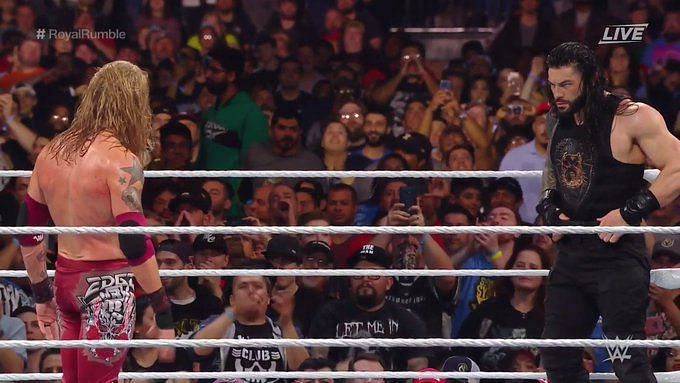 Edge and Roman Reigns teasing a dream match
