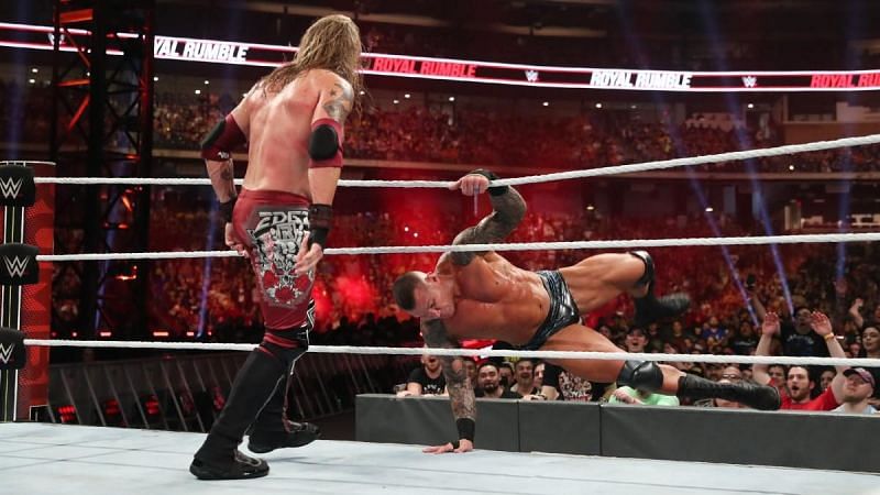 Edge flinging Randy Orton out of the ring