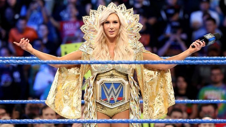 Charlotte showcasing one of her many Championship belts