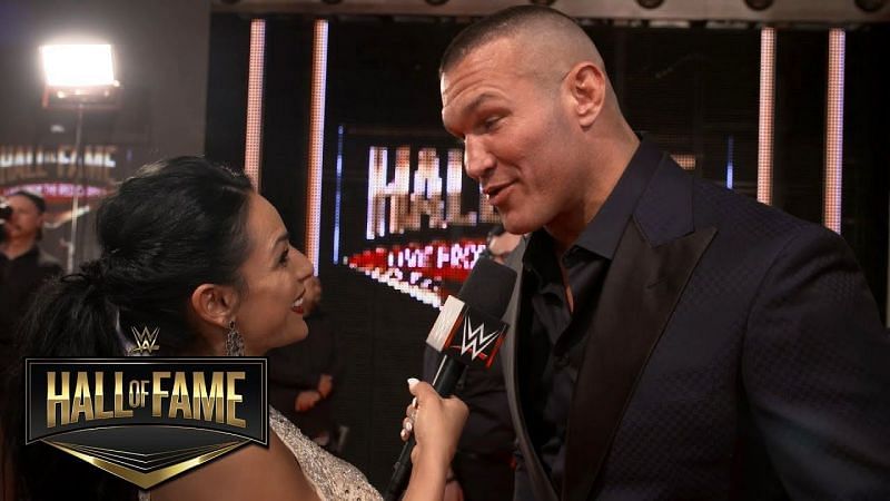 Orton and his wife posing during a Hall of Fame event