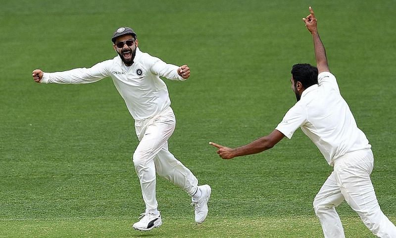 Ashwin and Virat Kohli celebrate the fall of a wicket