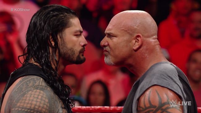 Roman Reigns (left) face-to-face with Bill Goldberg