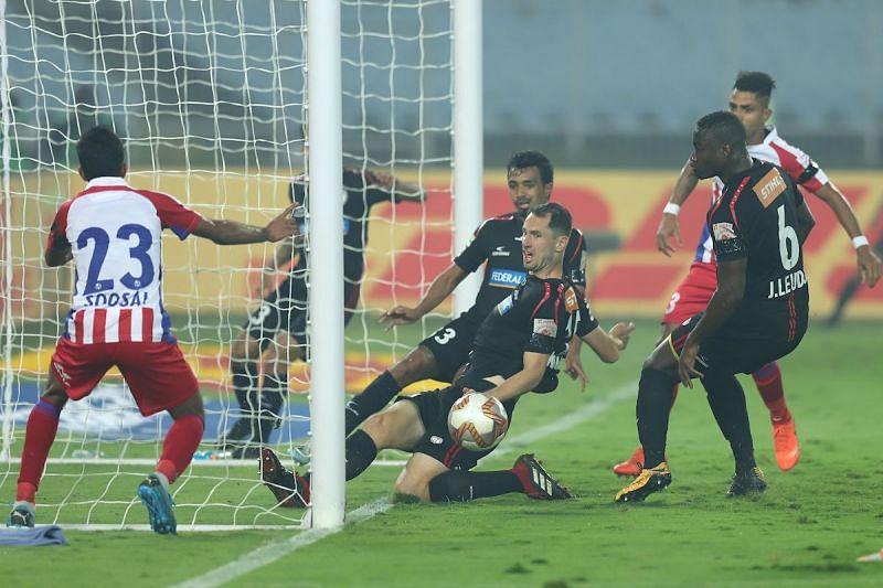 North East United FC&rsquo;s Mislav Komorski with a goal-line clearance to deny ATK&rsquo;s Michael Soosairaj