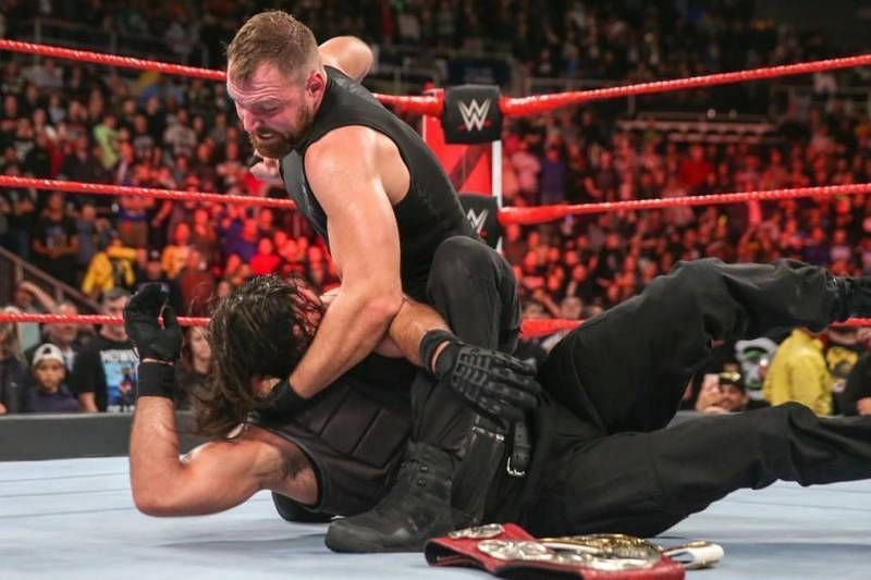 Dean Ambrose attacks Seth Rollins shortly after winning the RAW Tag Team Titles with him