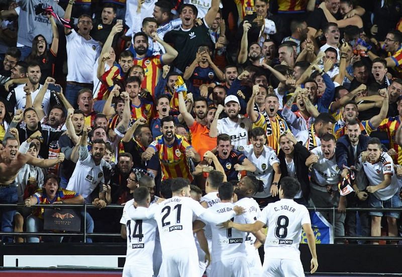 Valencia players celebrating a goal at Mestalla