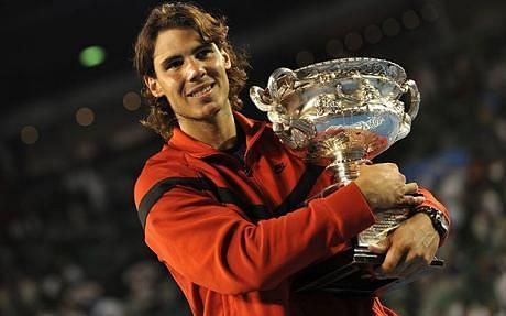 Rafael Nadal hoists aloft the 2009 Australian Open title