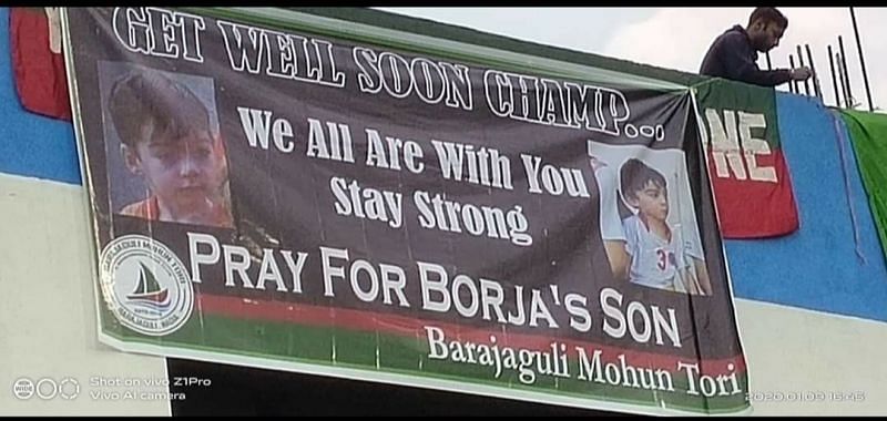 The banner in the field praying for the speedy recovery of Borja Gomez's son