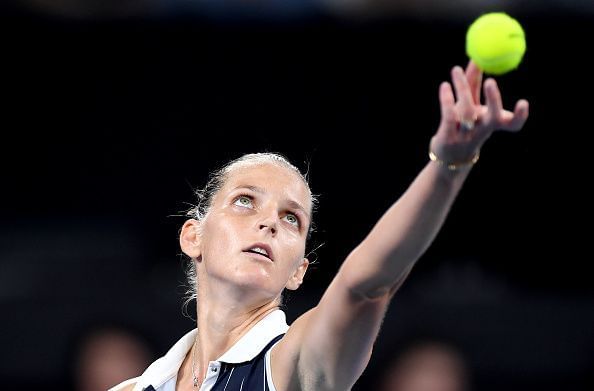 Karolina Pliskova has kept her title defence alive in face of extreme adversity.