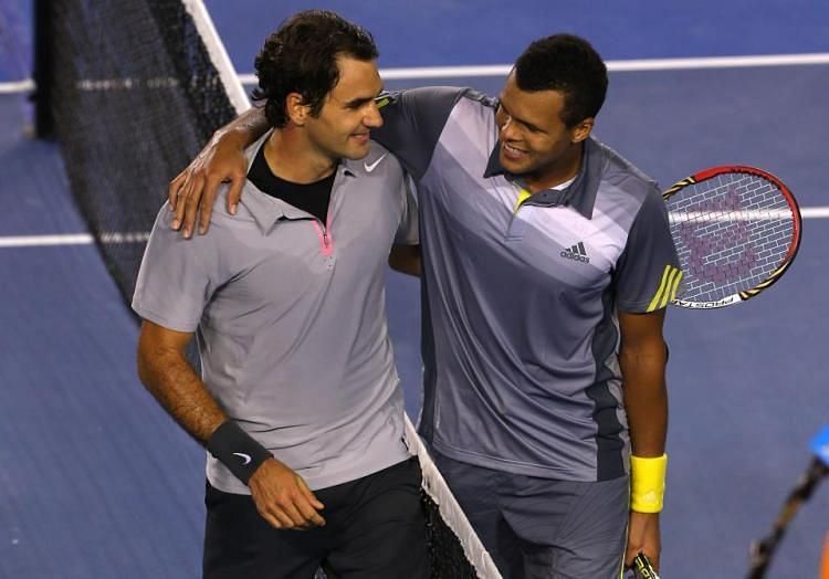 Federer and Tsonga meet at the net at the 2013 Australian Open