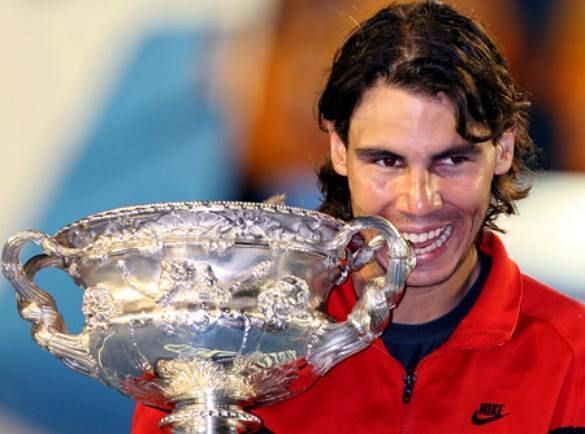 Rafael Nadal hoists aloft his lone Australian Open title in 2009 
