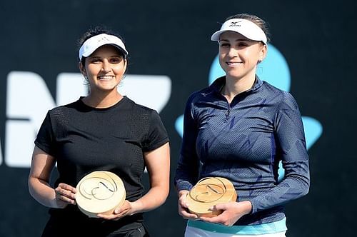 Sania Mirza poses with the trophy along with Nadiia